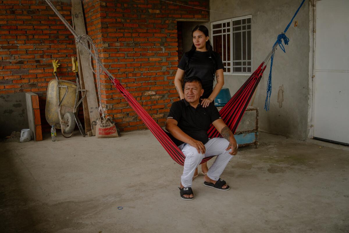 Jose Hernan Flores, former captain of the fishing vessel Negra Francisca Duarte II, poses for a portrait with his wife