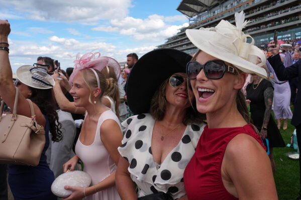 Racegoers react on the first day of the Royal Ascot horse race meeting in Ascot, England, Tuesday, June 16, 2026.(AP Photo/Kin Cheung)