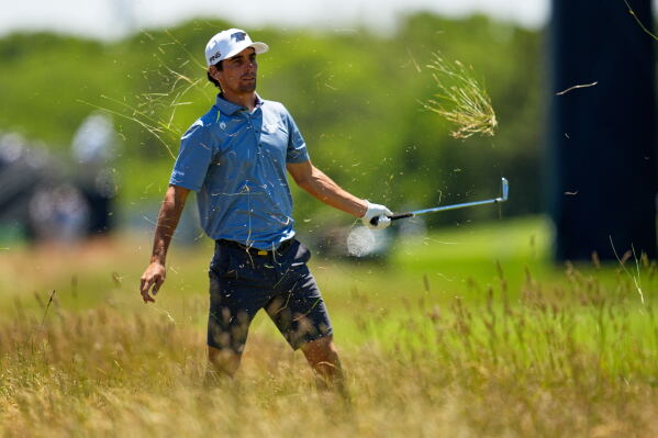 Joaquin Niemann hits from the rough on the third hole during a practice round for the U.S. Open golf tournament at Shinnecock Hills Golf Club in Southampton, N.Y., Tuesday, June 16, 2026.(AP Photo/George Walker IV)