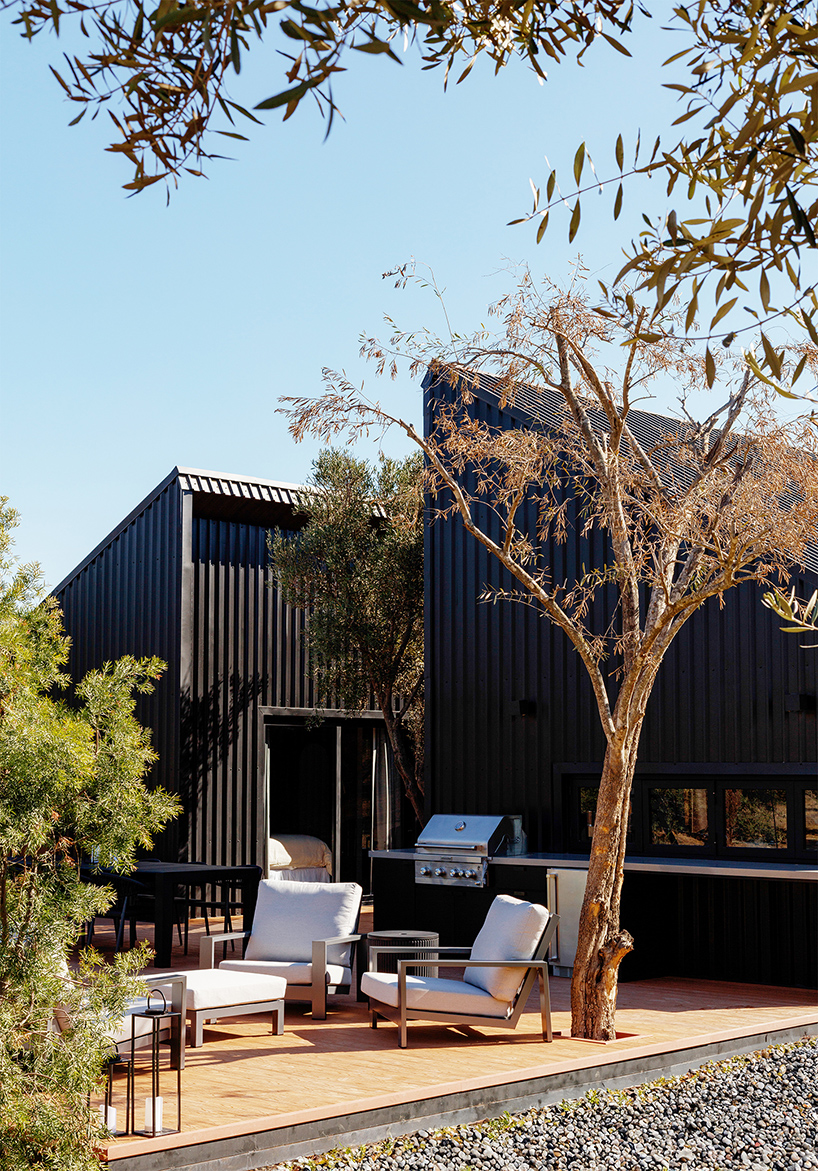 two corrugated metal volumes shelter courtyard retreat in mexico's desert landscape - 3