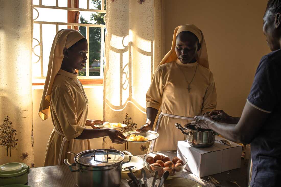 Young nuns prepare to serve breakfast to elderly sisters at the Little Sisters of St Francis premises in Nkokonjeru, Uganda, on May 12, 2026. The sisters work within the convent kitchen and dining areas as part of the daily care routine for retired members of the congregation. The Little Sisters of St Francis, a longstanding religious congregation in Uganda, organize communal life around shared meals, prayer, and service. Within the same compound, the congregation also provides ongoing care for elderly sisters who require assistance with daily needs, including meal preparation, medical support, and end-of-life care after decades of service in education, healthcare, and community outreach across the country.