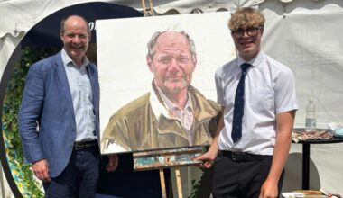 Charlie Ireland and Henry with the portrait © Worksop College