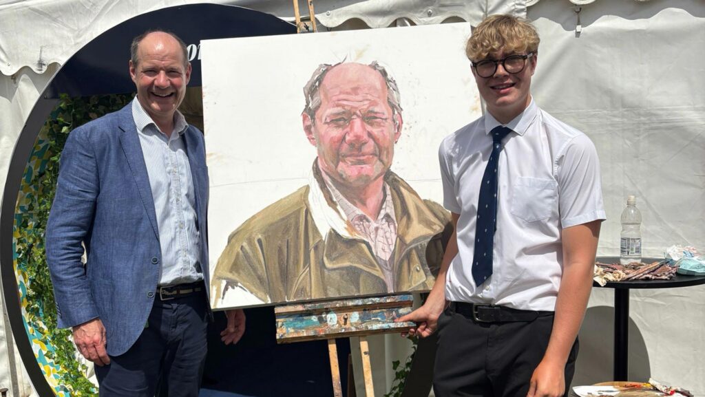 Charlie Ireland and Henry with the portrait © Worksop College