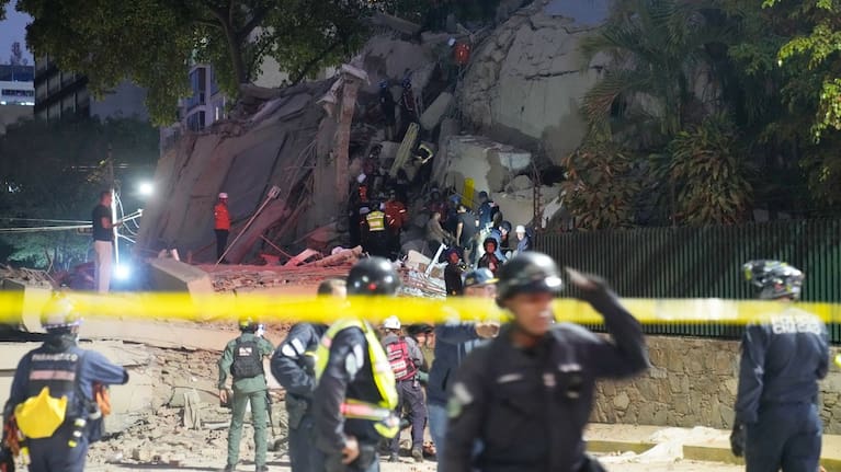 Rescue workers search for survivors at a collapsed building after an earthquake in Caracas, Venezuela.