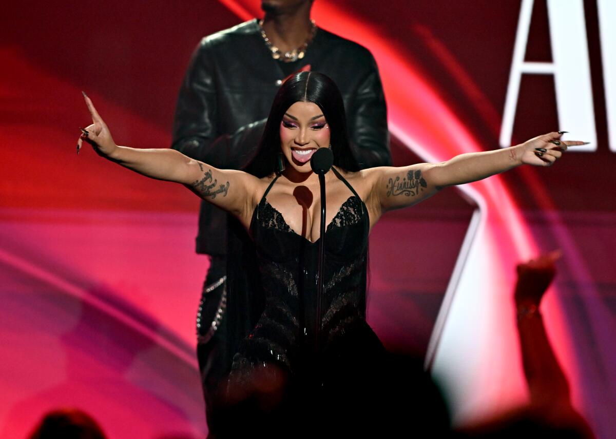 Cardi B accepts the female hip hop artist award during the BET Awards 2026 at the Peacock Theater in Los Angeles.