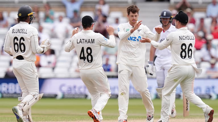 New Zealand's Mitch Santner (second right) celebrates with team-mates after taking the wicket of England's Gus Atkinson on day five of the Third Cricket Test at Trent Bridge Cricket Ground, Nottingham.