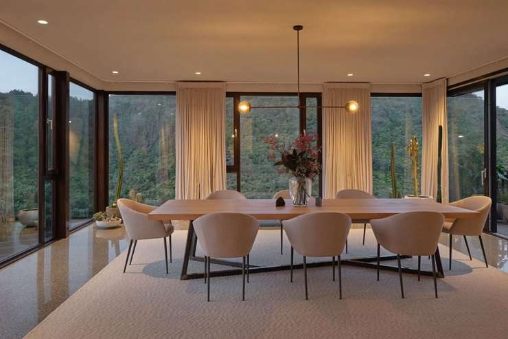 Jenene Crossan and Scottie Chapman are selling their luxury seven-bedroom beach escape at 27 Glenesk Road, above Piha’s Lion Rock, on Auckland's west coast. Photo / Supplied