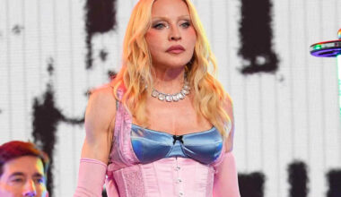 Madonna straddles barrier high above Times Square in scary moment from surprise concert