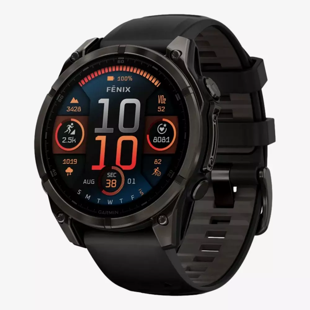A black Garmin Fenix smartwatch displays time, date, and fitness metrics on a colorful digital screen with a black silicone strap and metallic case—an ideal accessory to pair with your best golf shorts for stylish course performance.