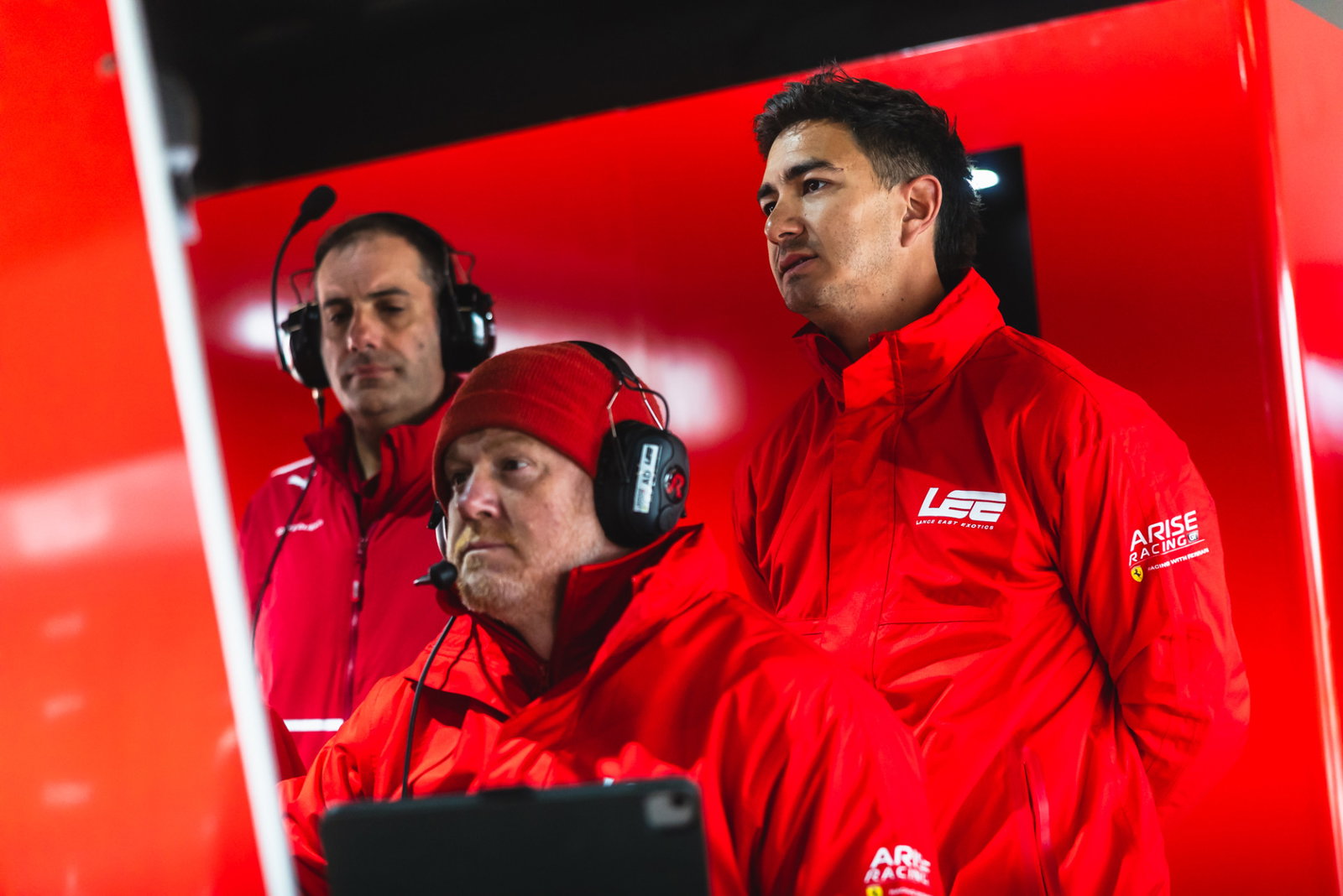Arise Racing GT driver Jaxon Evans (right) with engineer Adam DeBorre (middle).