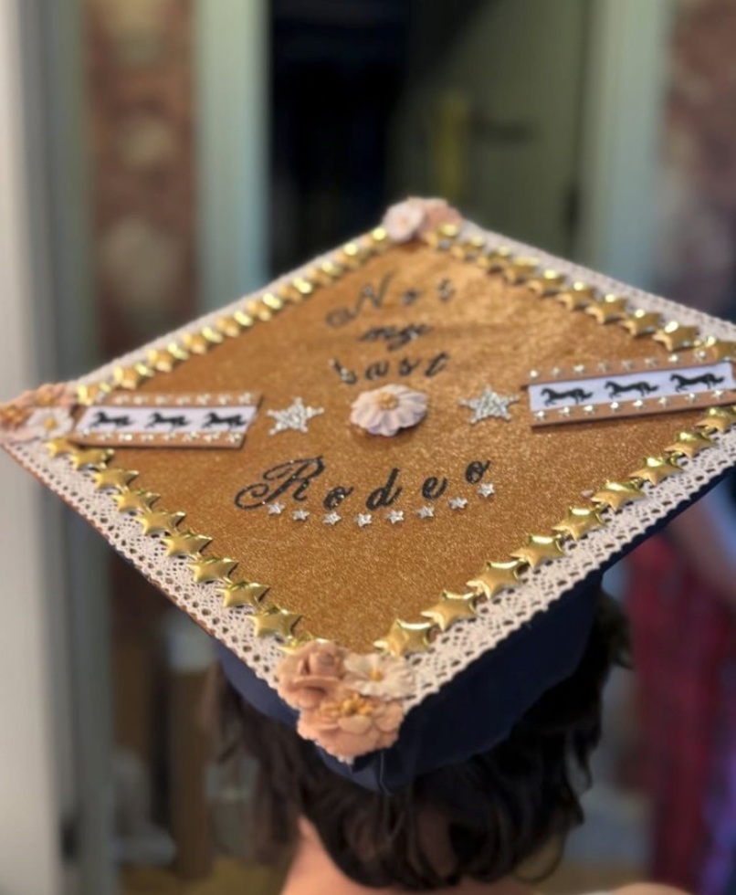 Oskar Muñiz shows off a personalized graduation cap featuring the phrase, "Not my last rodeo."