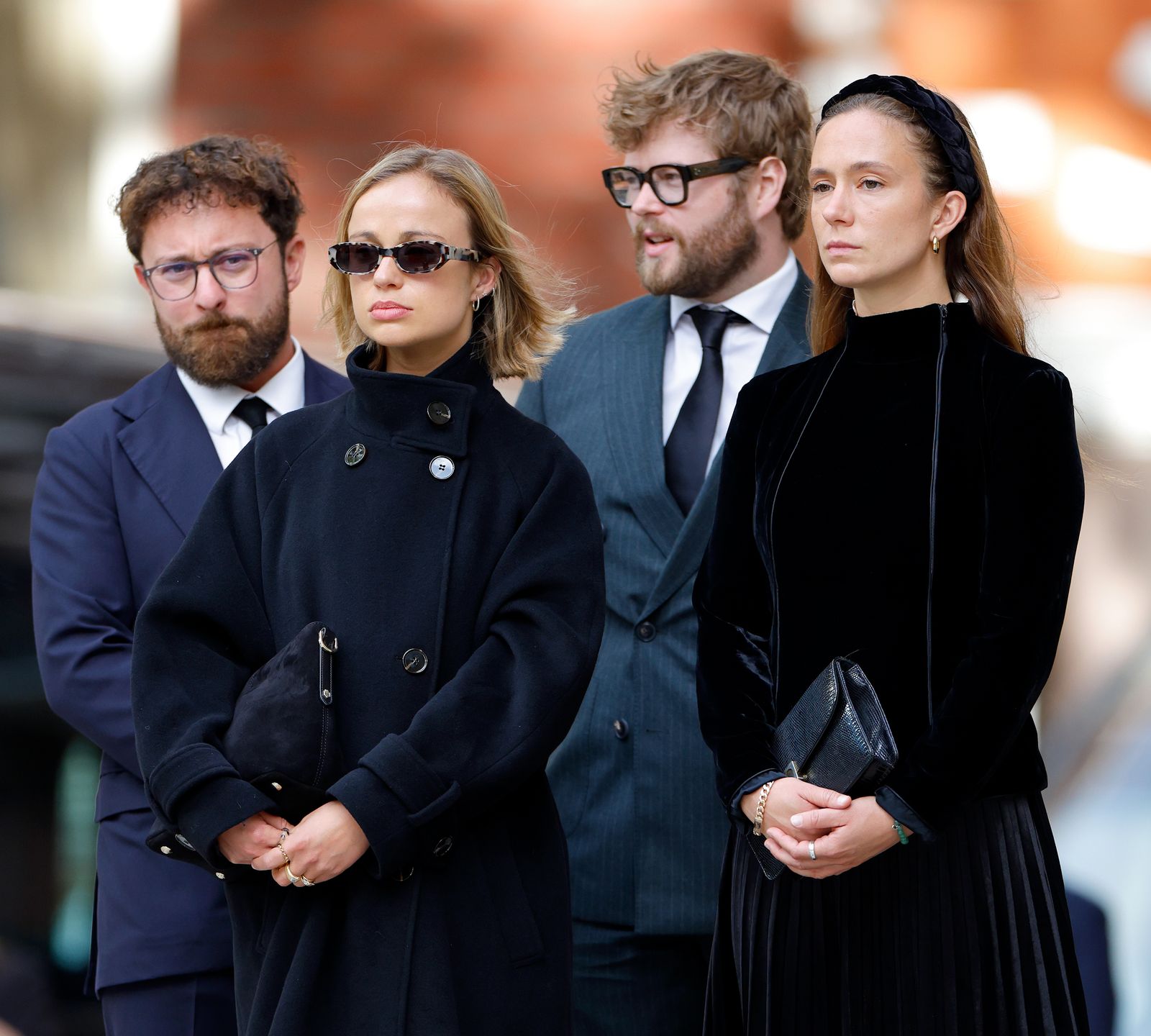 Image may contain Justin Torkildsen Eve Morey Clothing Coat Accessories Bag Handbag Adult Person and Formal Wear