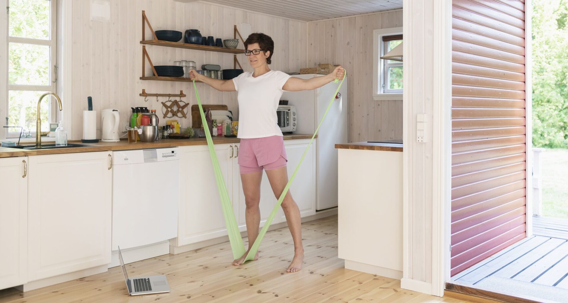 All you need is a resistance band and this versatile Pilates-inspired workout to keep fit anywhere