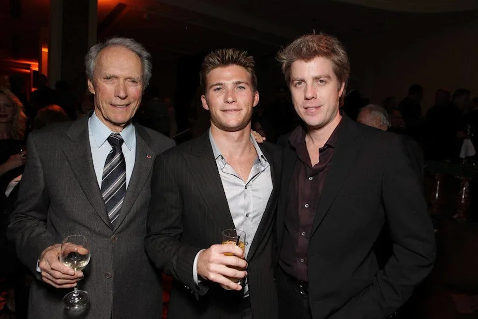 Clint Eastwood poses with sons Scott and Kyle at a film premiere.