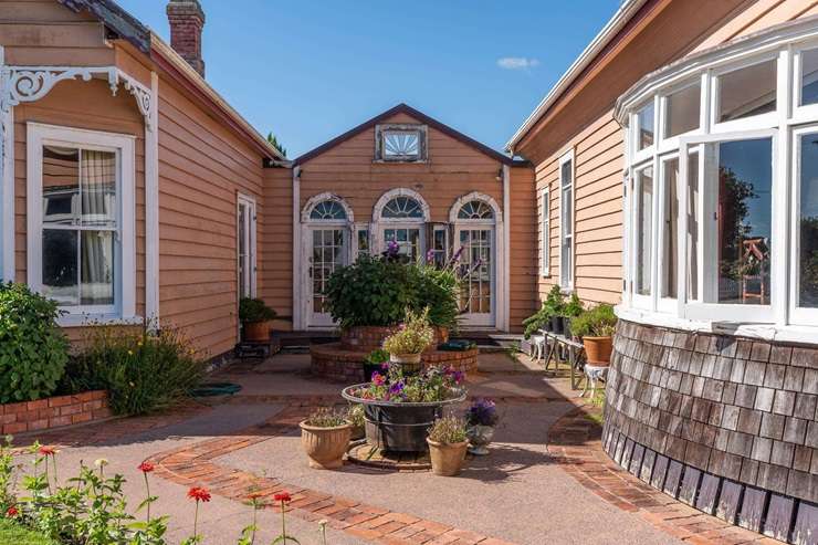 Jim Stuart and Cristine Leitch have listed their Edwardian-style home at 346 Tauwhare Road, in Matangi, Waikato. They want someone to buy their property and their vast collection of antiques. Photo / Supplied