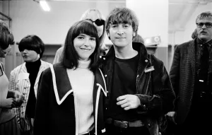Sue Cox photo bombing John Lennon during a meet and greet locker room Candlestick Park San Francisco August 29, 1966