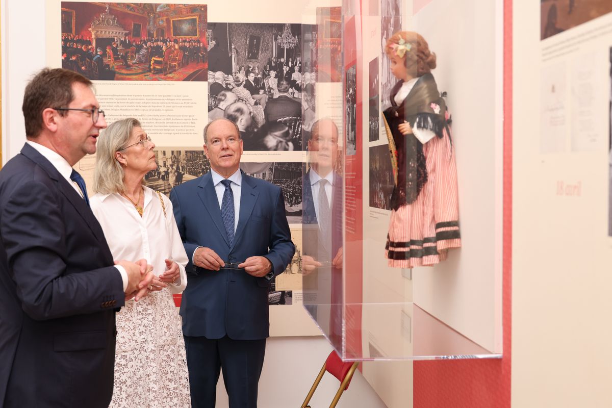 The exhibition features photographs, personal objects, and archival memorabilia related to the historic 1956 royal wedding. 