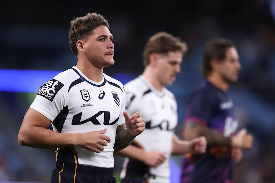 Reece Walsh warms up ahead of the game.