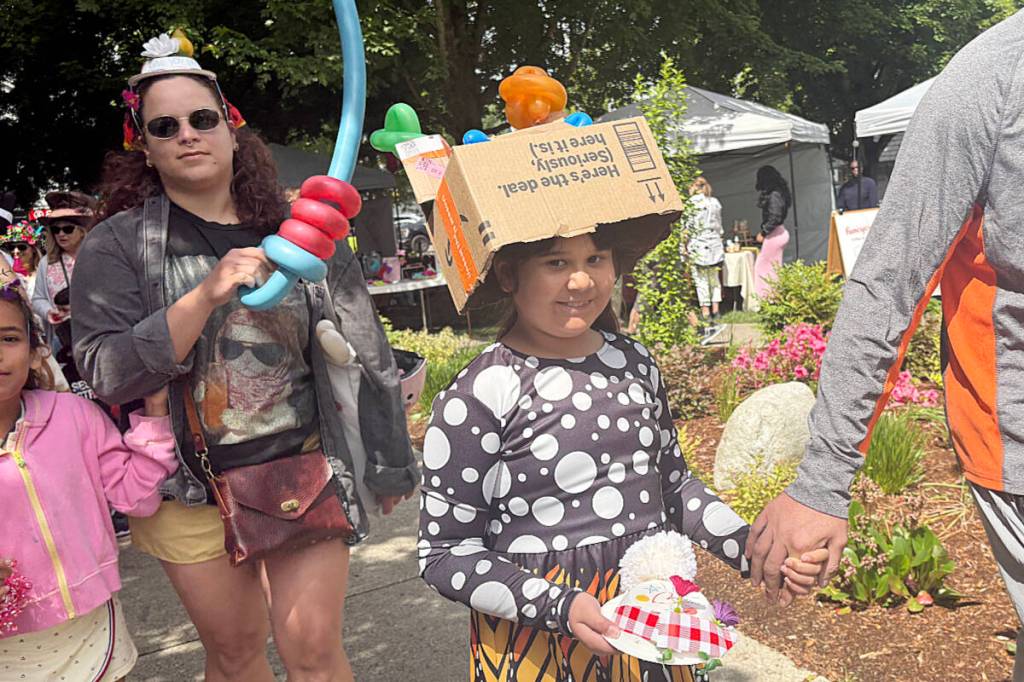 A little girl parades through Memorial Peace Park wearing her unique hat for the Mad Hatters Tea Party in support of mental health in Maple Ridge. (Colleen Flanagan/The News)