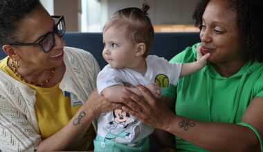 Alea Martinez (right) with her 8-month-old son Sincere Martinez and health worker Joyce Clark in Boston last month.