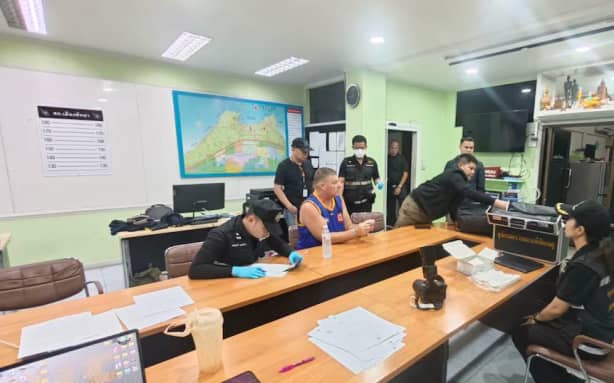 Simon Peter Carman at the Pattaya City Police Station after being taken into police custody after 17-year-old Tunchanok Donhomla was reported missing.
