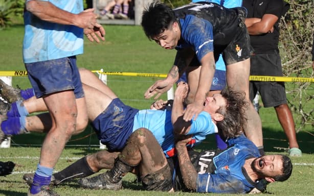 Parliament’s Brian George takes down Russell’s Tony Stokes just centimetres from the try line.