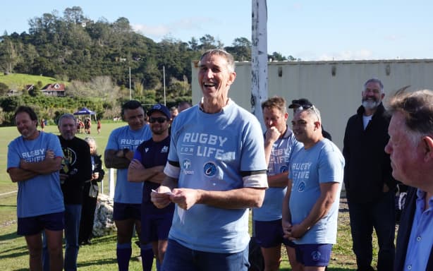 Russell coach Ian Jones delivers a pep talk ahead of the game.