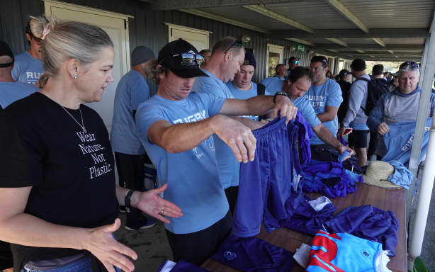 Jodi Osborne helps the Russell players choose their kit.