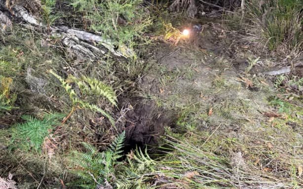 Bruce Miller plummeted about three metres down a dark hole. (Supplied: Country Fire Authority)