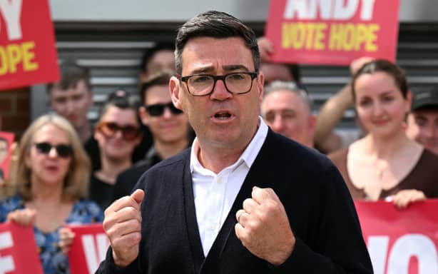 Labour party candidate Andy Burnham addresses supporters outside the Labour party campaign office in Ashton in Makerfield, northwest England, on June 18, 2026, as voters go to the polls to vote in the Makerfield by-election. Britain holds a unique vote on June 18 that could trigger the endgame for Labour leader Keir Starmer's beleaguered premiership, or win him a reprieve. (Photo by Oli SCARFF / AFP)