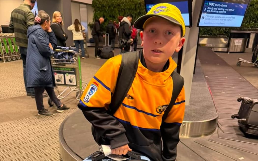 Hurricanes superfan Connor Grant and his dad travel from Auckland to Wellington for home games.