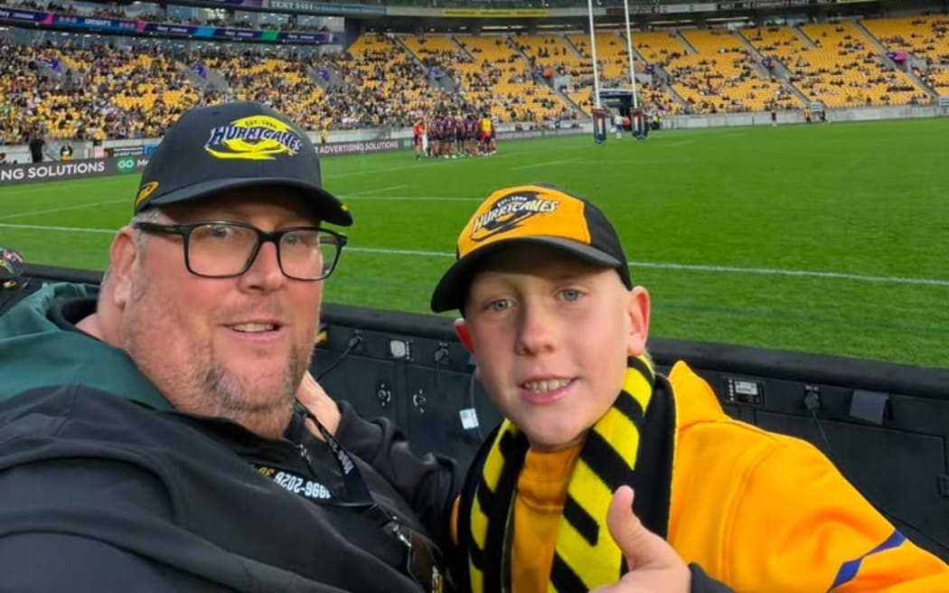 Andrew Grant and his son Connor enjoying the game.