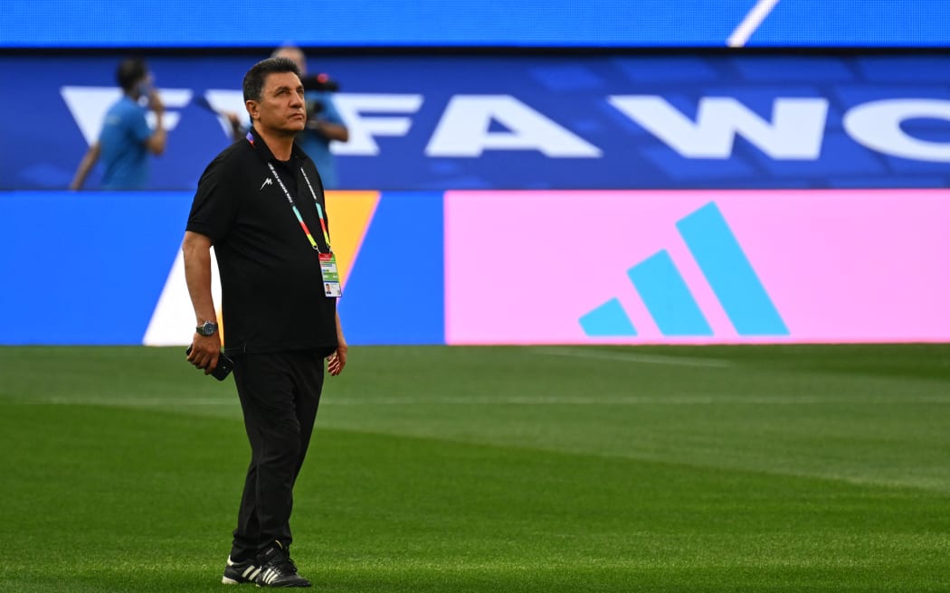 Iran's head coach Amir Ghalenoei walks around the pitch after the press conference at Los Angeles Stadium in Inglewood on June 14, 2026, on the eve of the 2026 World Cup football match between Iran and New Zealand. (Photo by Patrick T. FALLON / AFP)