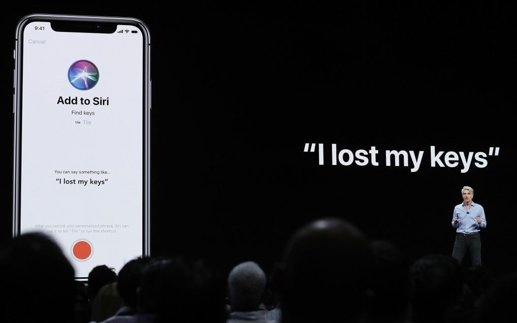 Craig Federighi, Apple's senior vice president of Software Engineering, speaks about Siri during an announcement of new products at the Apple Worldwide Developers Conference in San Jose, California on June 4, 2018.