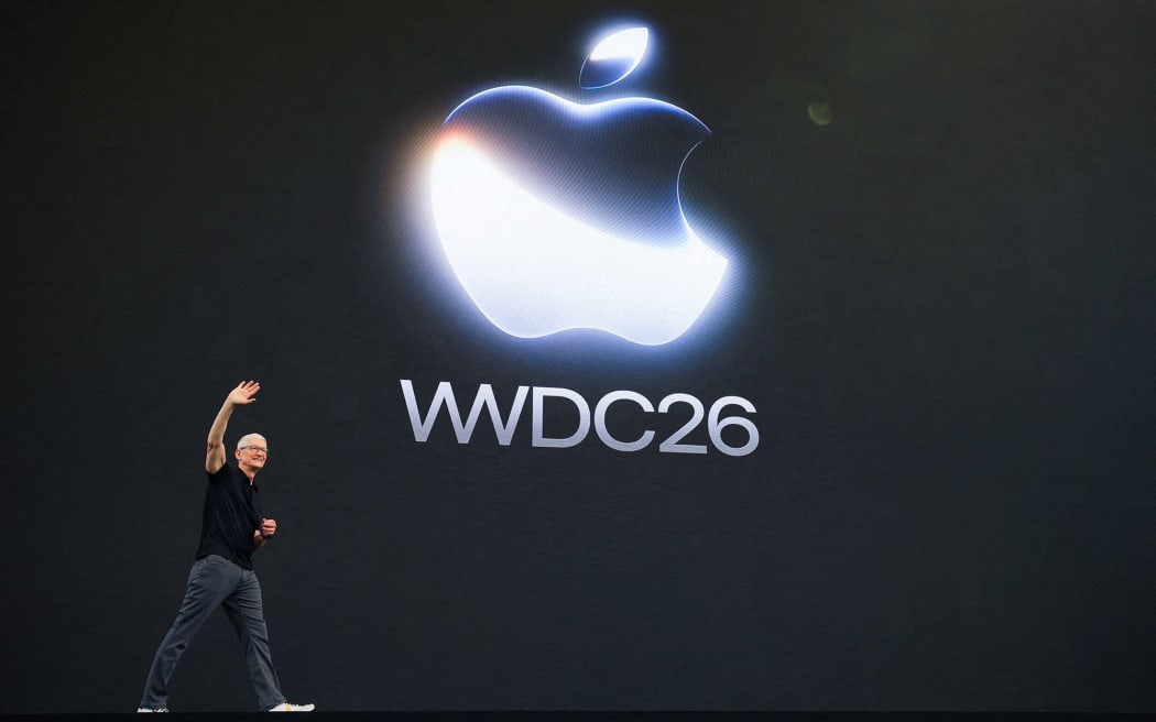 Apple CEO Tim Cook waves on stage during Apple's annual Worldwide Developers Conference in Cupertino, California, on June 8, 2026.