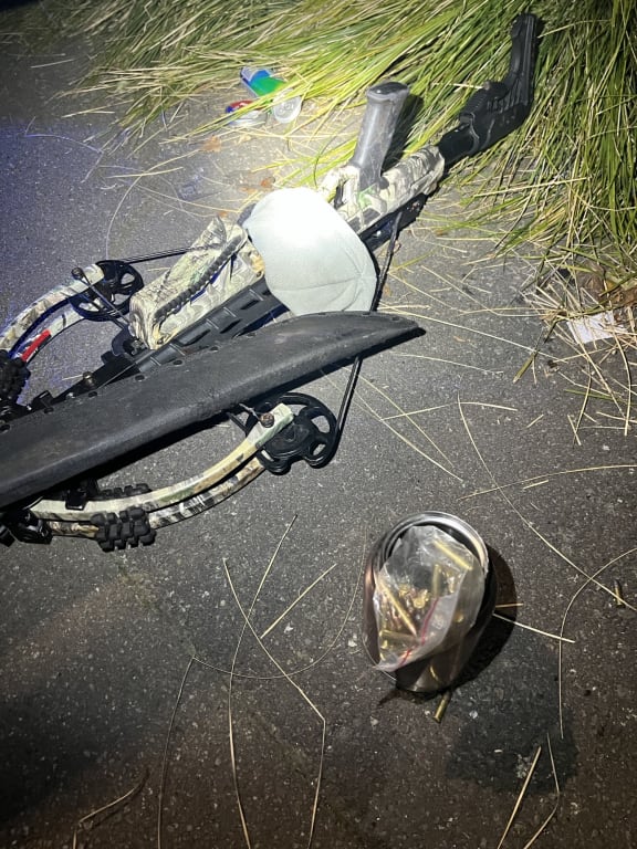 Weapons seized by police after a man was found with a loaded crossbow.