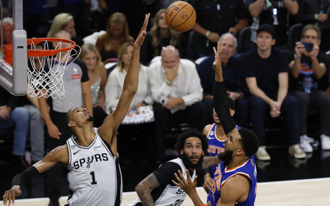 Victor Wembanyama #1 of the San Antonio Spurs blocks a shot attempt by Karl-Anthony Towns #32 of the New York Knicks during the first quarter in Game Five of the 2026 NBA Finals at Frost Bank Center on June 13, 2026 in San Antonio, Texas. NOTE TO USER: User expressly acknowledges and agrees that, by downloading and or using this photograph, User is consenting to the terms and conditions of the Getty Images License Agreement. (Photo by Ronald Cortes/Getty Images)