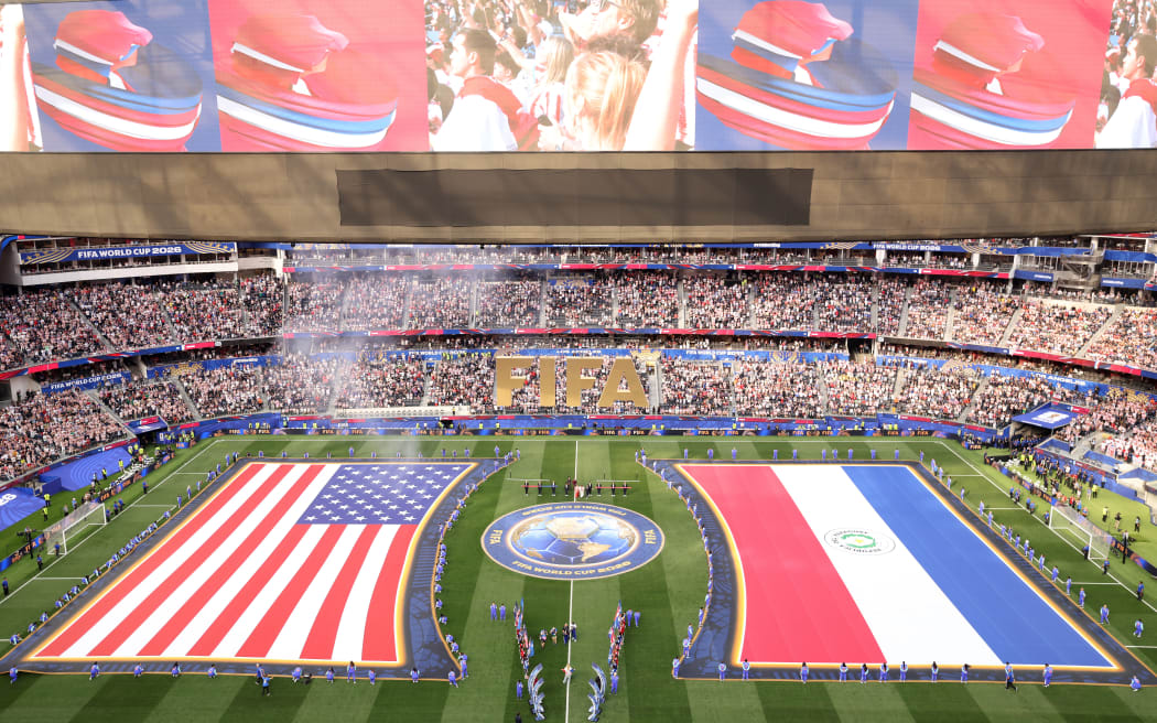 US and Paraguayan flags are seen ahead of the 2026 World Cup Group D football match between the USA and Paraguay at the Los Angeles Stadium in Inglewood on June 12, 2026. (Photo by Valerie MACON / AFP)