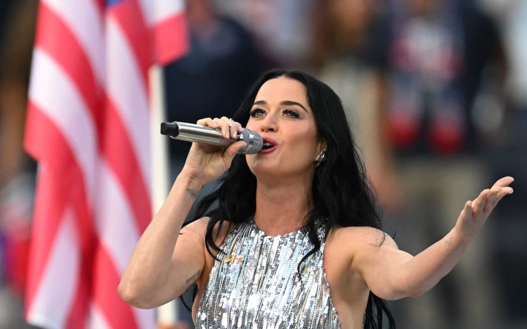 US singer-songwriter Katy Perry sings the national anthem ahead of the 2026 World Cup Group D football match between USA and Paraguay at the Los Angeles Stadium in Inglewood on June 12, 2026. (Photo by Patrick T. Fallon / AFP)
