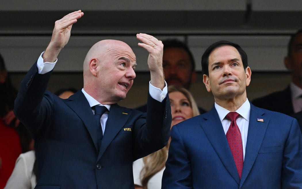 (L-R) FIFA president Gianni Infantino and US Secretary of State Marco Rubio talk ahead of the 2026 World Cup Group D football match between USA and Paraguay at the Los Angeles Stadium in Inglewood on June 12, 2026. (Photo by Patrick T. Fallon / AFP)