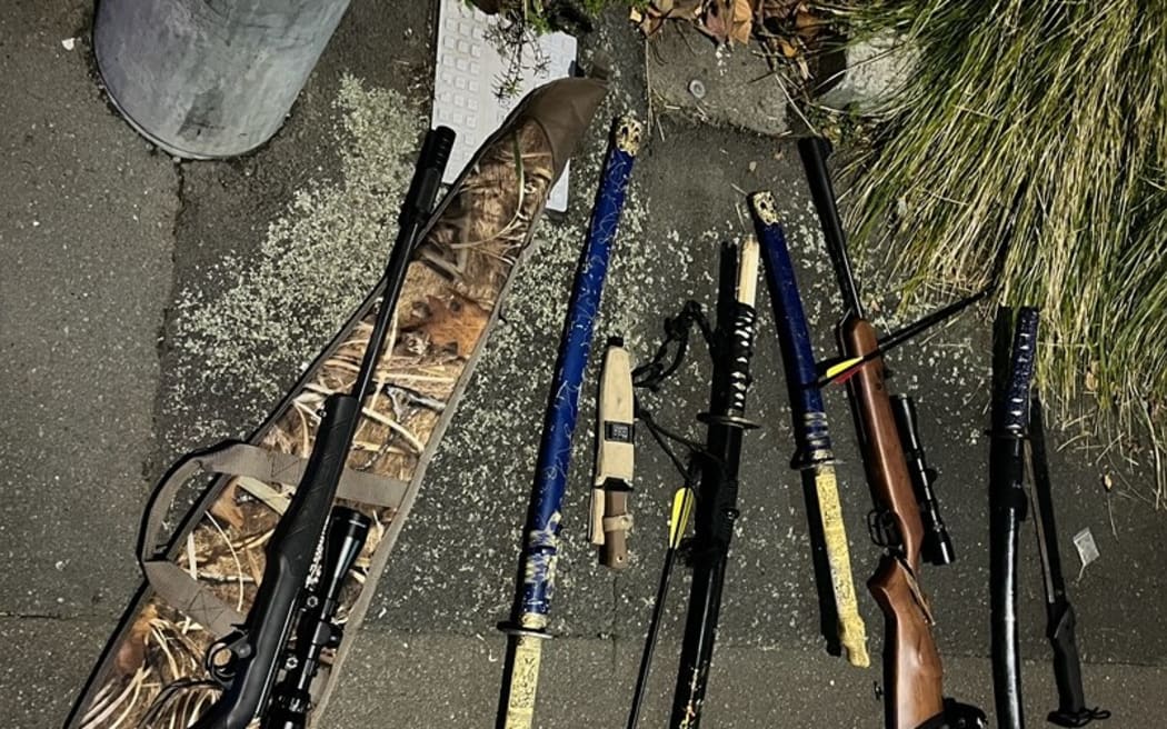 Weapons seized by police after a man was found with a loaded crossbow.
