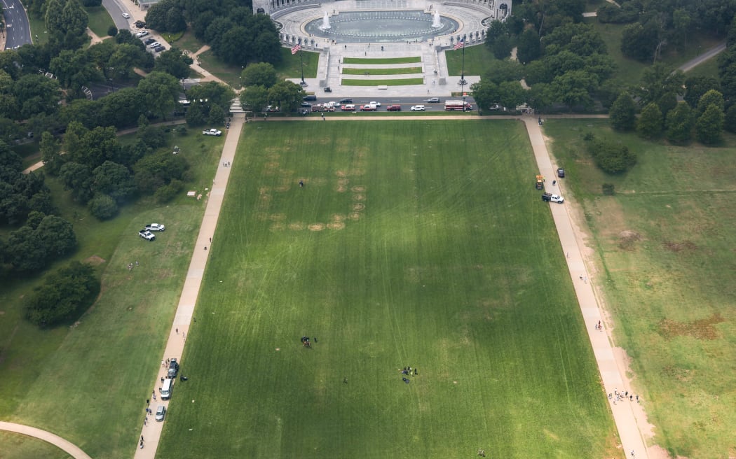 WASHINGTON, DC - JUNE 11: The numbers “8647” are shown in the grass on the National Mall on June 11, 2026 in Washington, DC. U.S. Park Police is handling the investigation into the markings in the grass. Anna Moneymaker/Getty Images/AFP (Photo by Anna Moneymaker / GETTY IMAGES NORTH AMERICA / Getty Images via AFP)