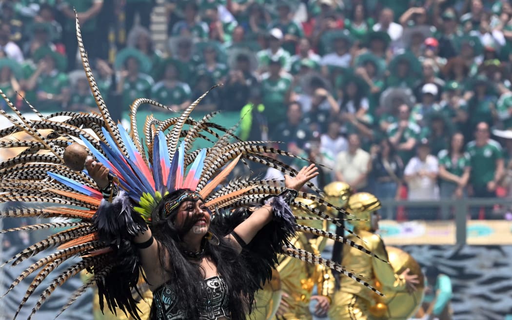 Artists perform during the opening ceremony ahead of the 2026 World Cup Group A football match between Mexico and South Africa at the Mexico City Stadium in Mexico City on June 11, 2026. (Photo by Yuri CORTEZ / AFP)