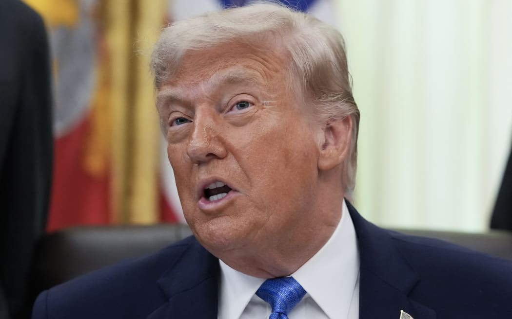 US President Donald Trump speaks during a signing ceremony for the "Secure America Act" in the Oval Office of the White House in Washington, DC, on June 10, 2026. The bill provides around $38 billion for Immigration and Customs Enforcement (ICE), $26 billion for Border Patrol and another $5 billion for unforeseen costs, effectively ensuring a steady flow of money for Trump's deportation agenda through fiscal 2029. (Photo by Ken Cedeno / AFP)