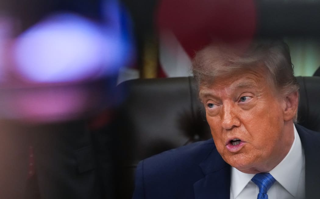 US President Donald Trump speaks during a signing ceremony for the "Secure America Act" in the Oval Office of the White House in Washington, DC, on June 10, 2026. The bill provides around $38 billion for Immigration and Customs Enforcement (ICE), $26 billion for Border Patrol and another $5 billion for unforeseen costs, effectively ensuring a steady flow of money for Trump's deportation agenda through fiscal 2029. (Photo by Ken Cedeno / AFP)