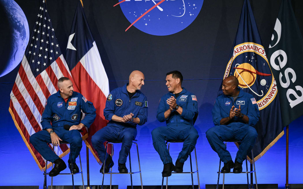 (L/R) NASA astronaut commander Randy Bresnik, ESA (European Space Agency) astronaut pilot Luca Parmitano, NASA astronaut mission specialist Frank Rubio, and NASA astronaut mission specialist Andre Douglas speak during a press conference announcing the crew for the Artemis III mission at NASA's Johnson Space Center in Houston, Texas, on June 9, 2026. The Italian Luca Parmitano will be the pilot of NASA's Artemis 3 voyage, the first European to join one of the program's missions. Parmitano, who will represent the European Space Agency, is one of four men named as crewmembers tasked with carrying out Artemis 3, which is targeting launch in late 2027. (Photo by RONALDO SCHEMIDT / AFP)