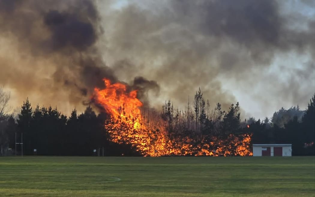 Fire burned through 200m of a macrocarpa hedge at Waitaki Boys High School, Oamaru, on 9 June 2026.
