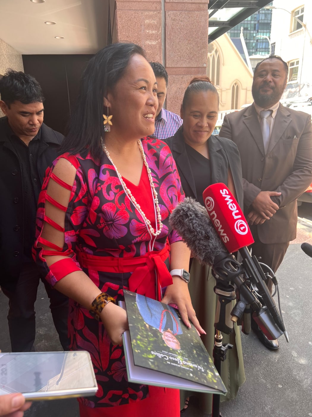 Vasa Fia Collins speaks to media outside the Auckland Coroner's Court during a case management conference in March 2025.