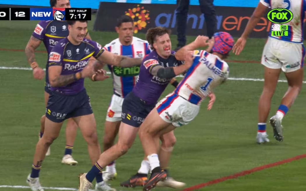 Cameron Munster shoves Kalyn Ponga during Melbourne's 32-30 win. (Supplied: Kayo Sports)