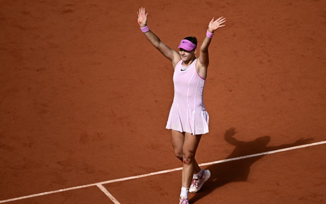 Russia's Mirra Andreeva celebrates after winning her women's final singles match against Poland's Maja Chwalinska on day 14 of the French Open tennis tournament on Court Philippe-Chatrier at the Roland-Garros Complex in Paris on June 6, 2026. (Photo by JULIEN DE ROSA / AFP)